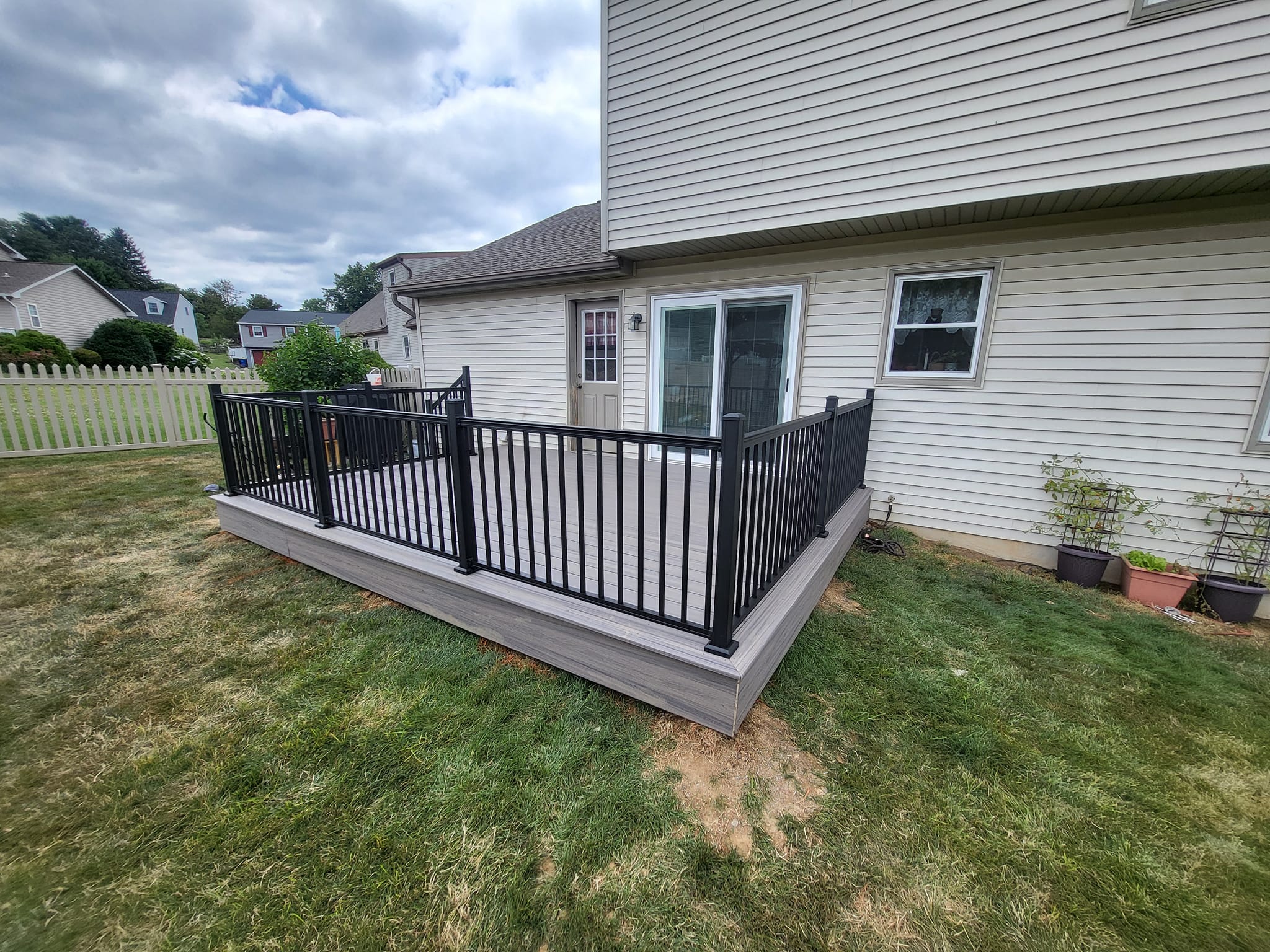 Outdoor living space with composite deck built by LR Contracting