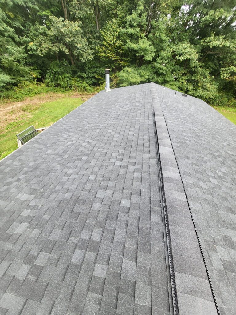 Before and after roof replacement completed by LR Contracting