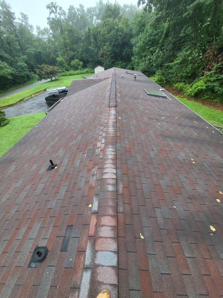 Before and after roof replacement completed by LR Contracting