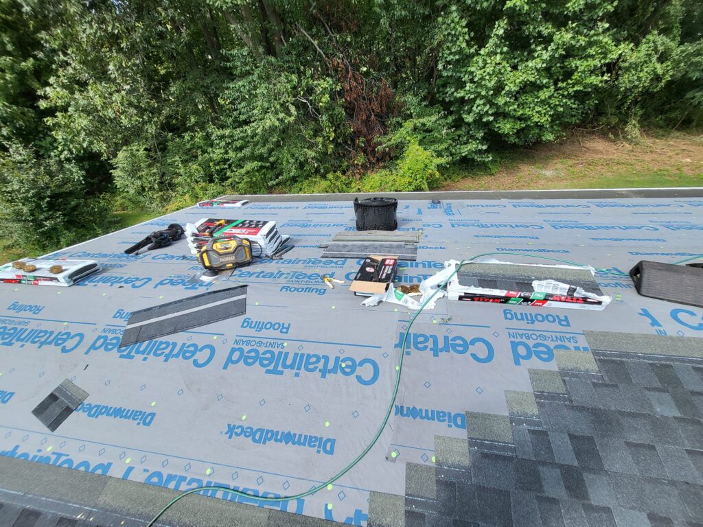 Before and after roof replacement completed by LR Contracting