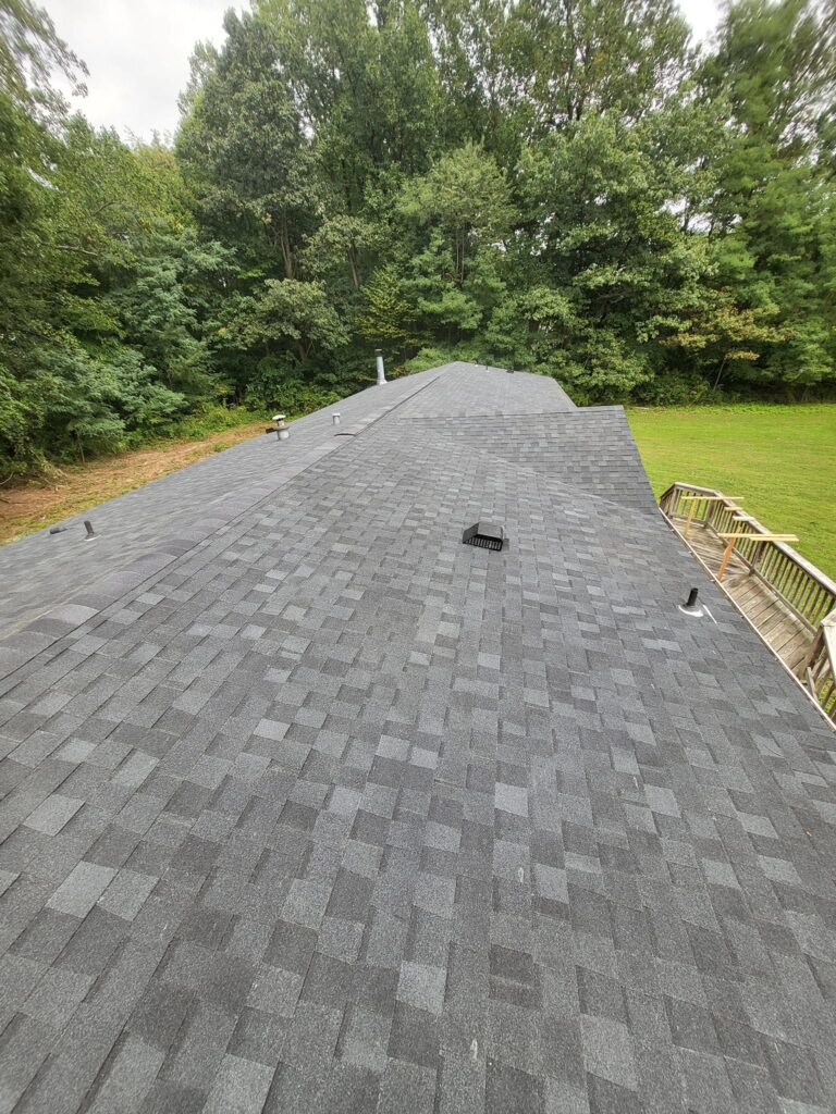 Before and after roof replacement completed by LR Contracting