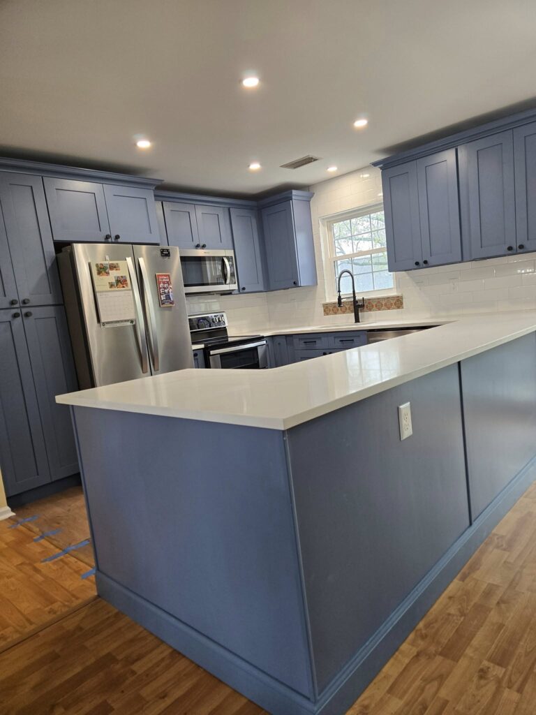 Modern kitchen renovation showcasing new cabinets and countertops