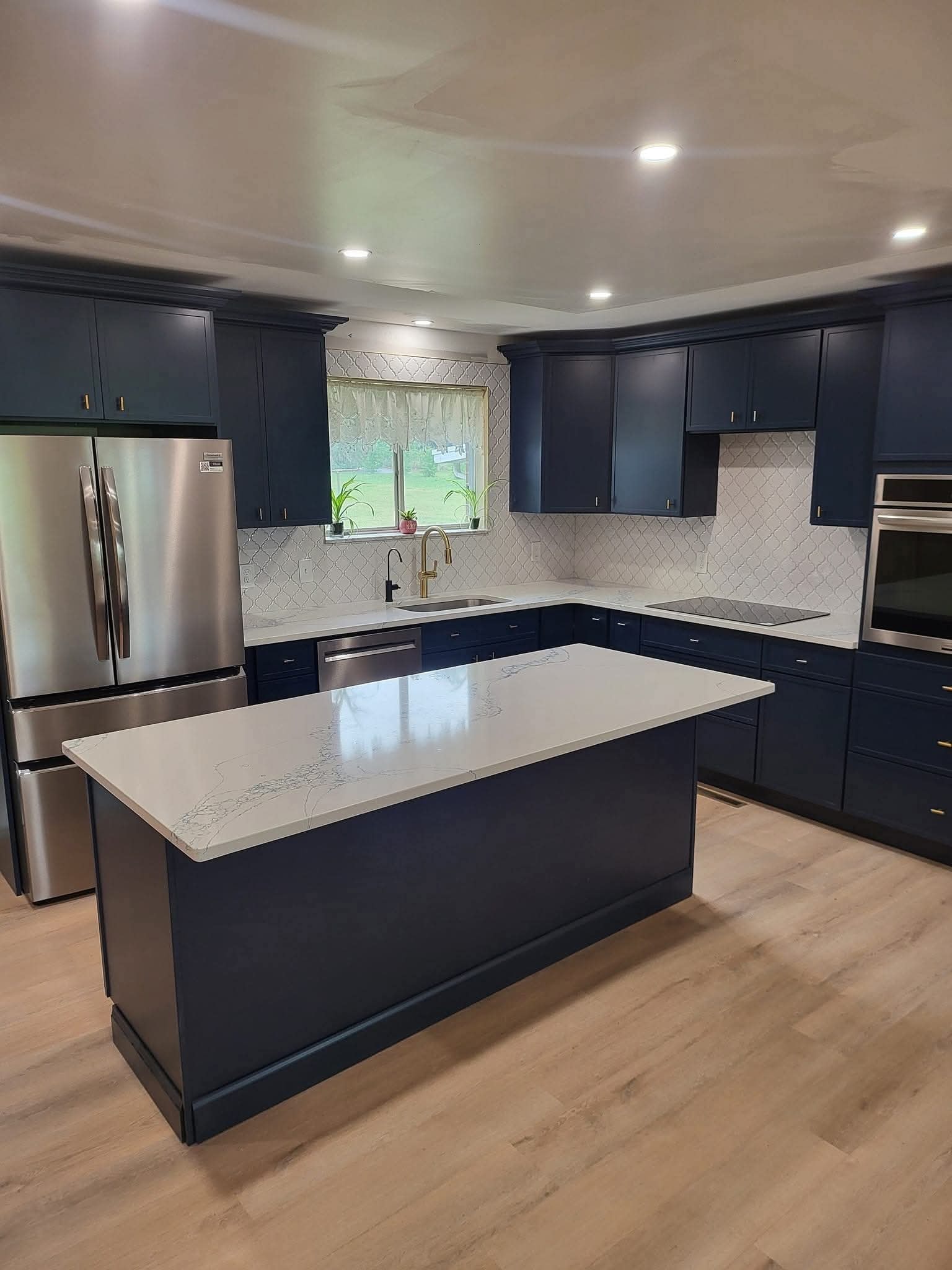 new kitchen with stainless steel appliances