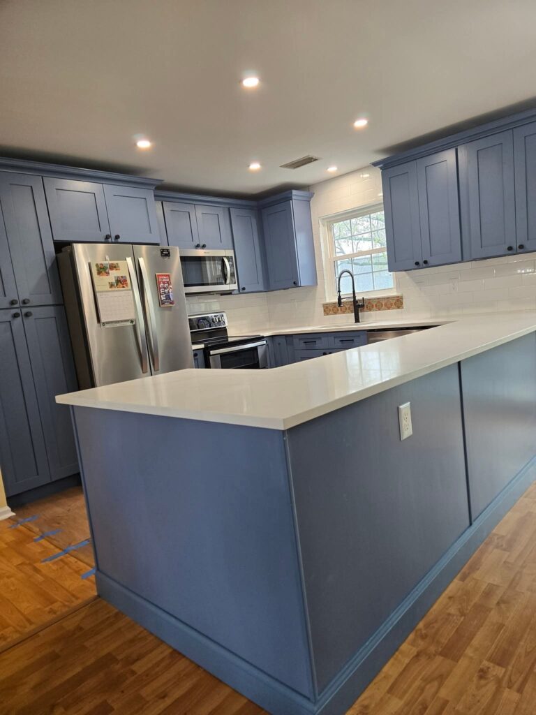 remodeled kitchen with blue cabinets