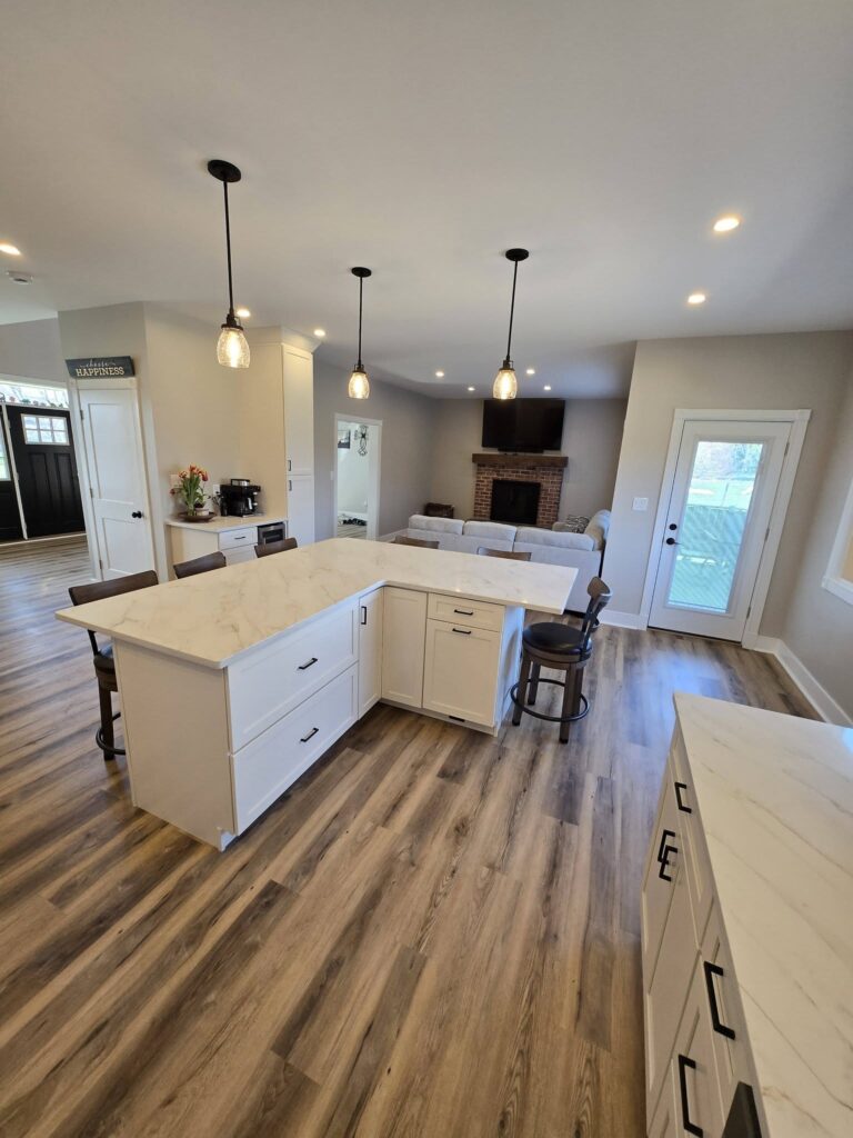 Kitchen island with view of the living-room fireplace - LR Contracting, Honey Brook PA