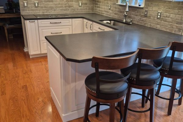 Peninsula with bar seating and stone backsplash - LR Contracting, Limerick PA