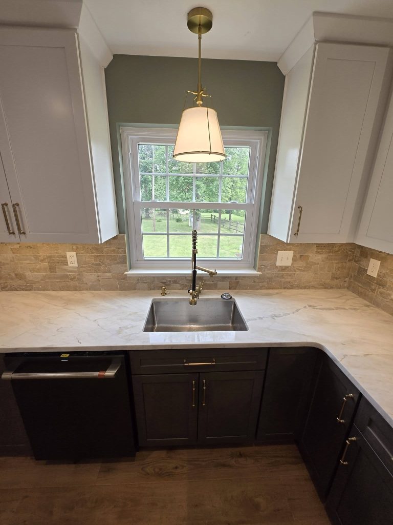 Sink under the window with a brass pendant light - LR Contracting, Sadsburyville PA