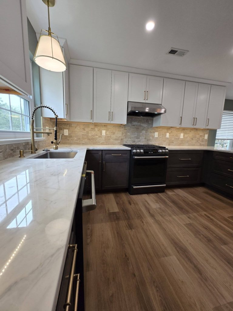 Gold faucet and quartz countertop along the sink wall - LR Contracting, Sadsburyville PA